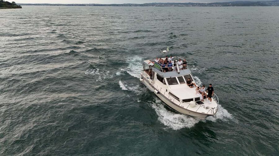 Desenzano del Garda: Sunset Boat Trip at Sunset with Drink - Music, Prosecco, and the social side