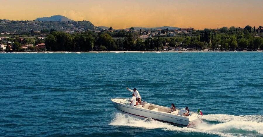 Lazise: Sunset Cruise with Wine aperitif on lake Garda - Leaving Lazise beside the Venetian Dogana
