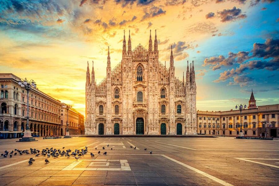 The marble front of Milan Cathedral in late afternoon light