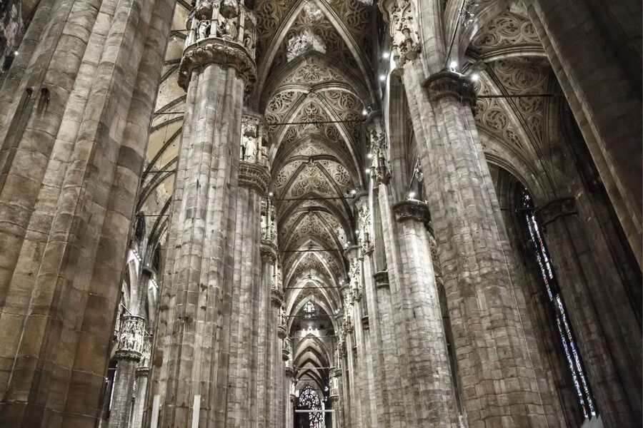 Milan: Duomo Rooftop and Cathedral Guided Tour with Tickets - Entering Milan Cathedral after the roof