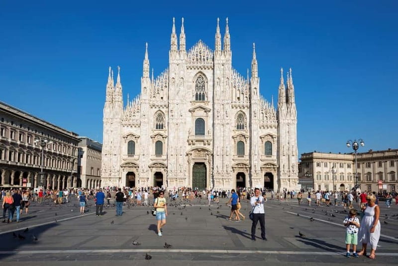 Milan: Duomo Tour with Priority Entry & Rooftop Access - Entering Milan Cathedral through a separate entrance