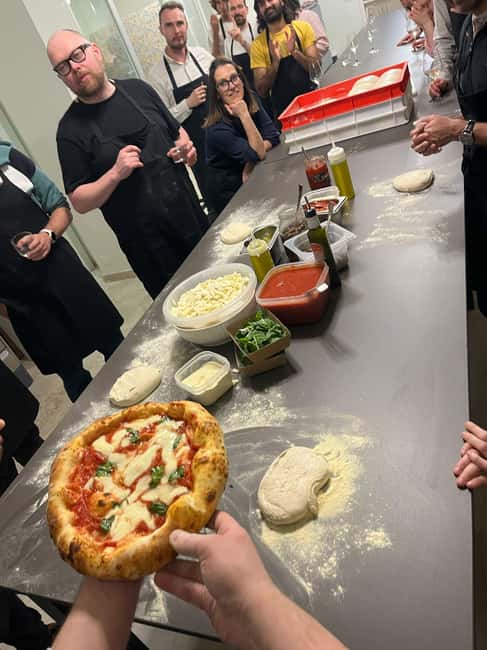 Milan: Pizza and Tiramisu Cooking Class with Wine Tasting - The kitchen setting and group size