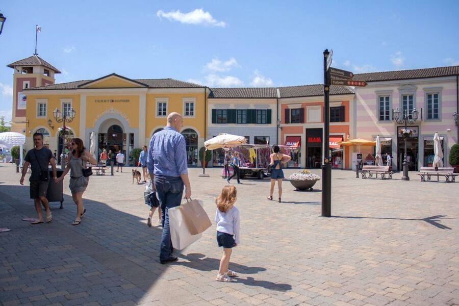 Milan: Serravalle Designer Outlet Roundtrip Bus Transfer - A pedestrian center with places to pause