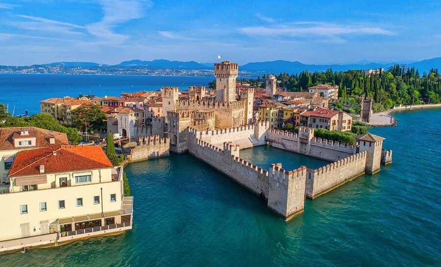 Milan: Verona Day Tour with a Lake Garda Cruise to Sirmione - Cruising Lake Garda toward Sirmione