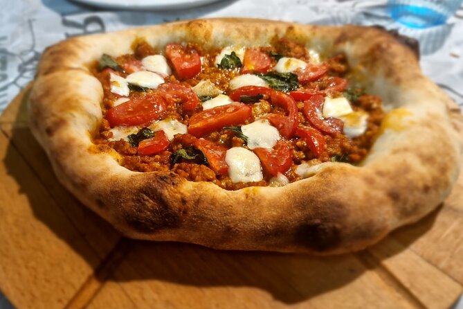 Neapolitan DOC Pizza Class And Cooking in a Wood Oven at a Local's house - Mixing dough with serious flour and yeast