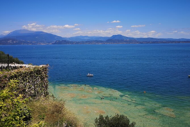 Sirmione away from the Crowds Boat Cruise Guided Walk and a Drink - Lido delle Bionde and views toward Monte Baldo
