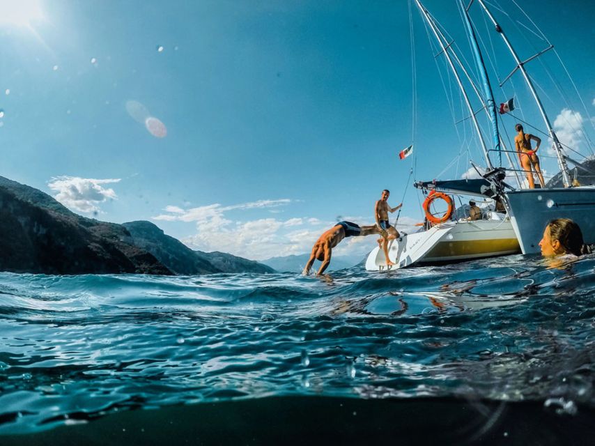 Valmadrera: Lake Como Sailing Trip with Prosecco and Snacks - The crew makes the small boat work