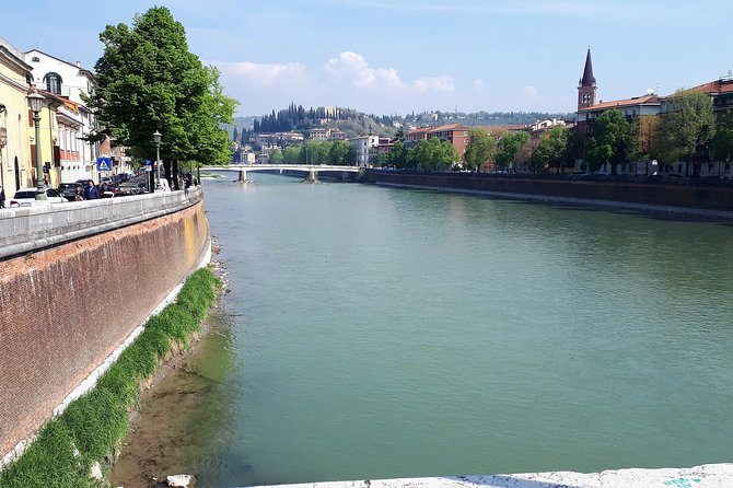 Verona & Lake Garda with Boat Cruise: Full-Day Tour from Milan - Sirmione: castle walls at the edge of Lake Garda
